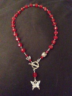 Red beaded necklace with matching earrings