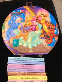 Winnie the Pooh 8-book collection and carrying case. It measures about 7” across. The books measure 4” x 3”.