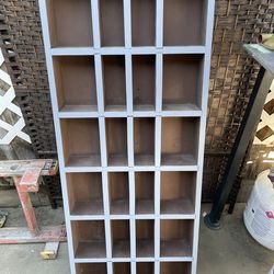 Solid wood organizer - 20 inches wide/ 4 inches deep /. 48 inches high / has 24 cubicals