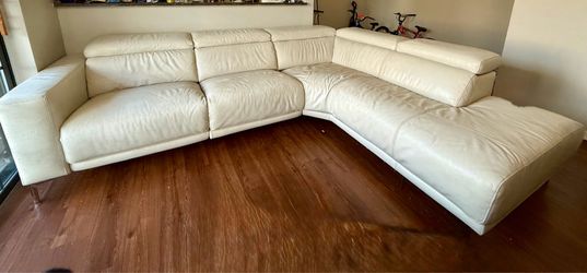 White cream Leather power sectional with chase.