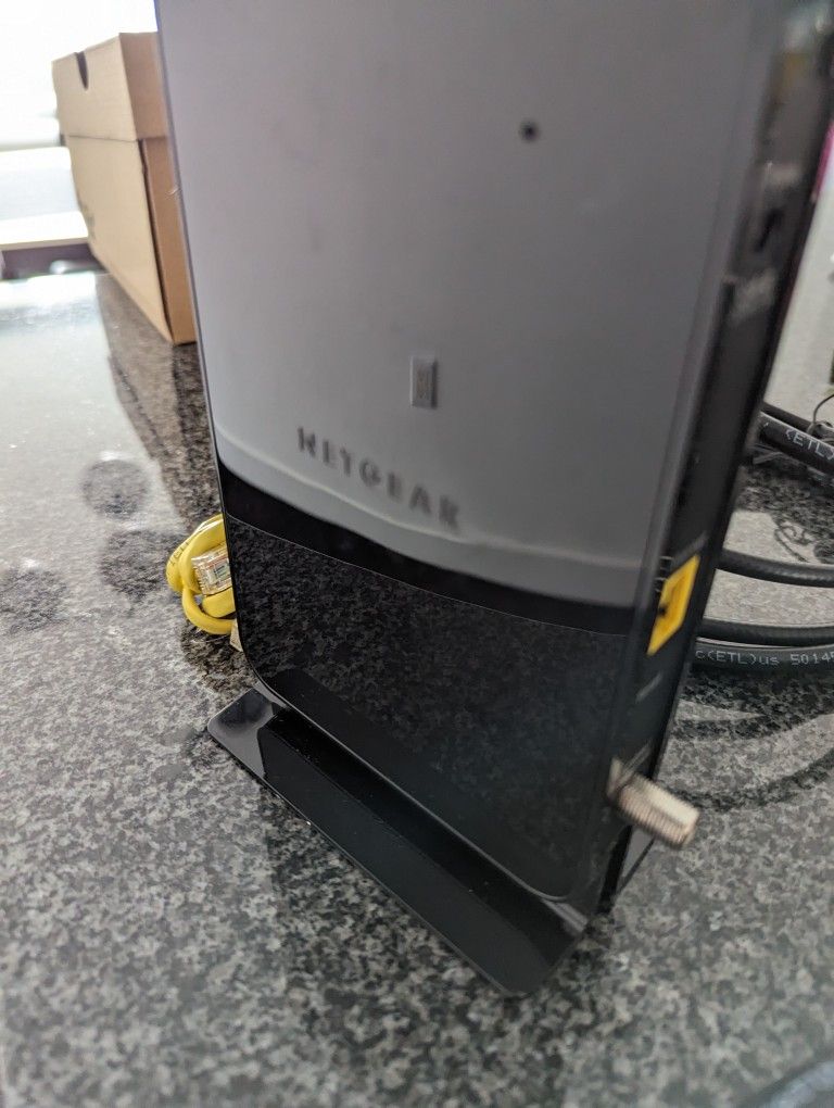 Netgear Router And All The Necessary Cables