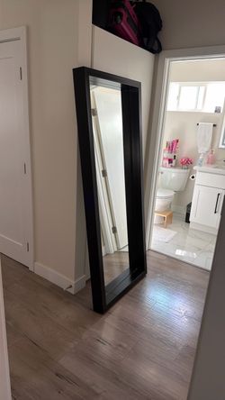 Long mirror with frame. Modern