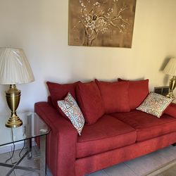 Red Sofa, Loveseat, Center Tables, 2 End Tables, 2 Lamps and Rug.