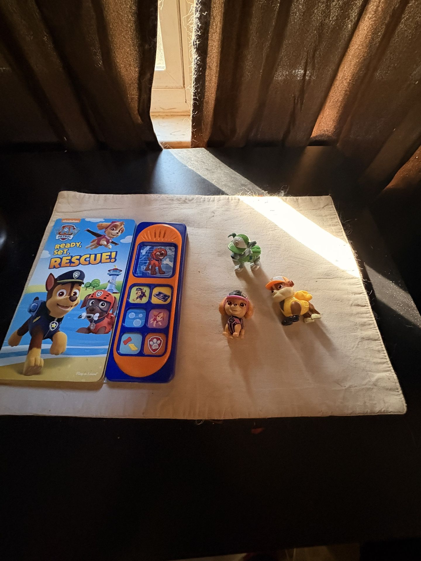 Paw Patrol Talking Book and three characters