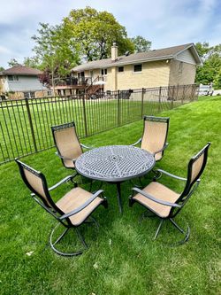 Patio set, aluminum table with 4 swivel chairs, only used for 2 month, like new, delivery available for extra cost