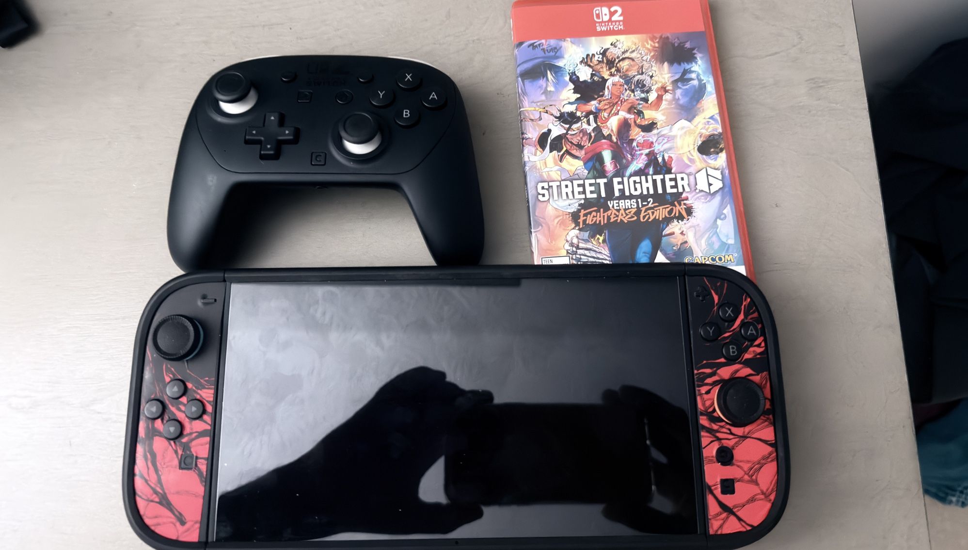 Nintendo switch 2 with Street Fighter 6  Switch 2 pro controller with D Brand case and screen protector