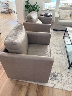 Pair of Leather Swivel Chairs