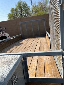 $2800 OBO 16’ long, Back & Side Ramp for easy loading.