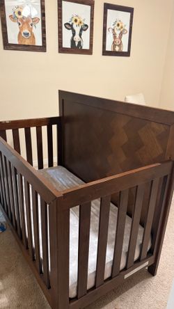 Brown wood crib