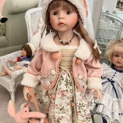 porcelain beautiful doll with, dress , jacket, hat, hand bag and stand
