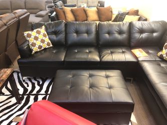 Black sectional sofa with ottoman