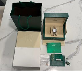 Model Number: 126231 Rolex Datejust 36mm Chocolate Index Dial Two Tone Everose Gold Fluted Bezel Jubilee Bracelet  Is great condition bought from the