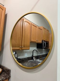 Large circle gold trim mirror