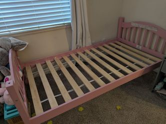 Two pink kids twin bedframes