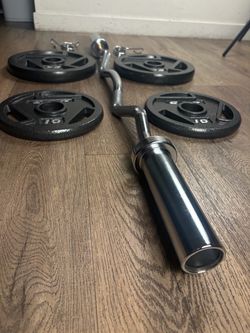 Beautiful BRAND NEW Curl Bar With Pair Of 25s And 10s All BRAND NEW in cardboard tube/box. Need Better Price$$$ I recommend that you look for used