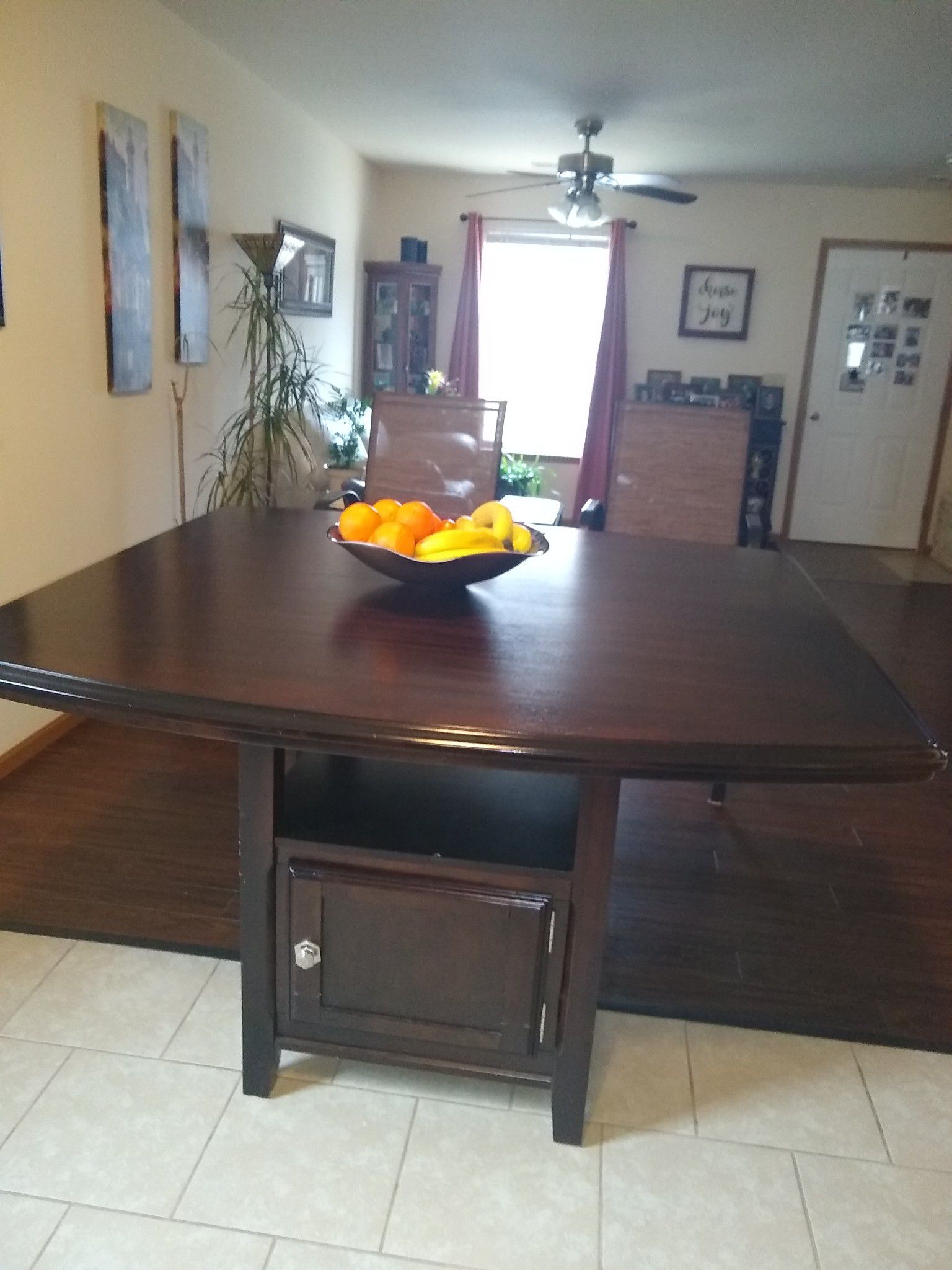 Counter height table. Also has a leaf. No chairs