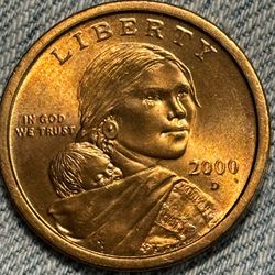 A 2000 P Golden Sacagawea Dollar a deep, beautiful gold color. Please make decent offer.