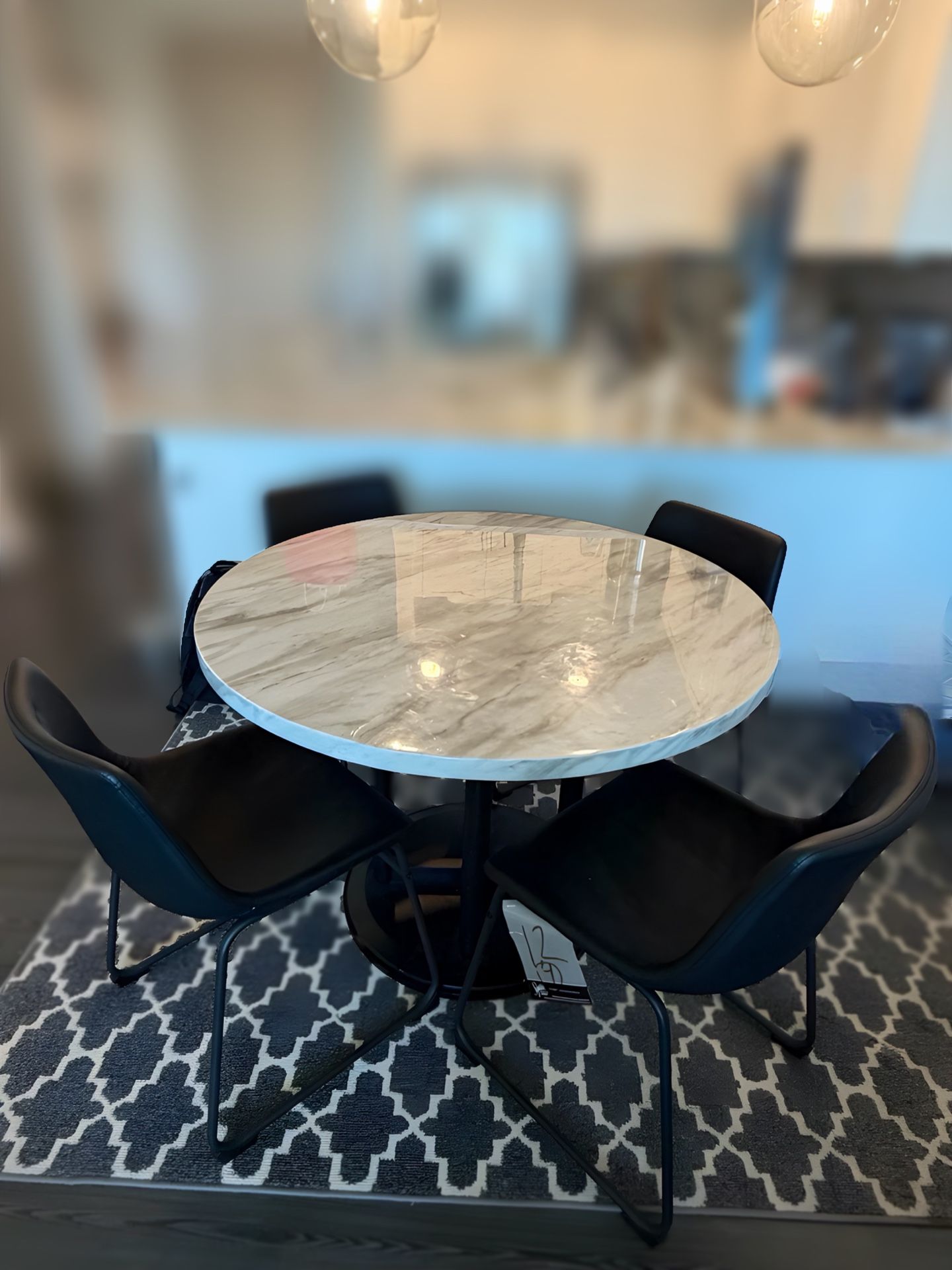 Round Grey Kitchen Table with 4 Black Chairs