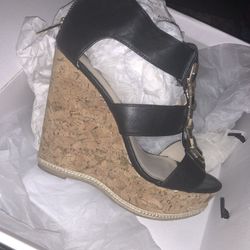 Aldo black and gold wedges