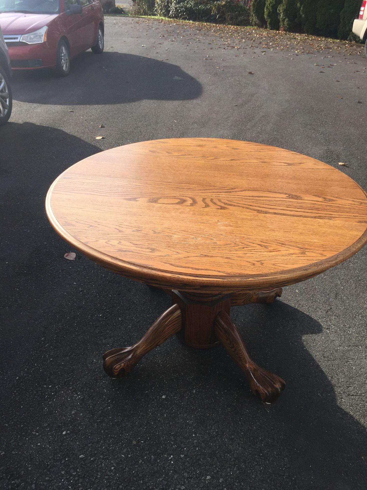 Solid oak dining table seats up to at least 10. 3 leaves