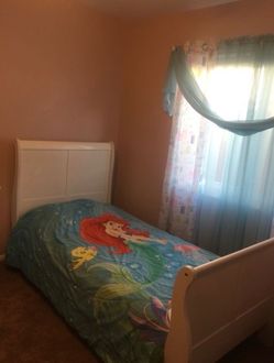 White Bed and a Bed Side Table