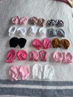 14 pairs of baby mittens