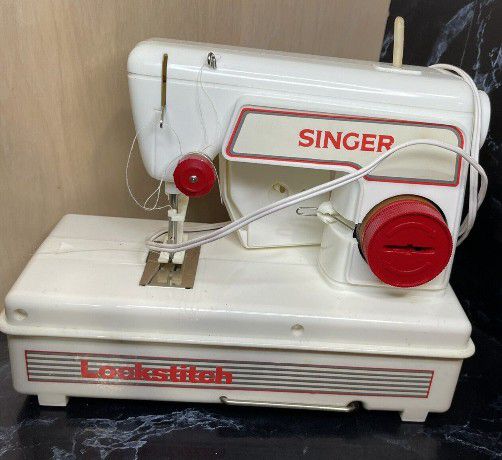 Mini Singer Sewing Machine.. 25.00