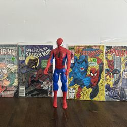 Vintage Spider-Man comic books and one Spider-Man action figure