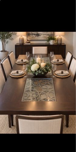 Elegant dining table with extension and chairs.
