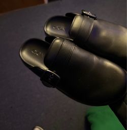 Black leather coach clogs