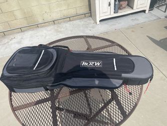 Electric or bass guitar travel case or backpack carrier .