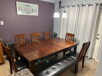 Dining Table, entry, lamp and coffee tables. Area rug.