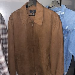 Brown zip-up jacket with a suede-style finish. Clean, timeless look — perfect for fall and winter.