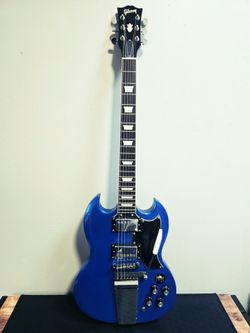 Blue Sparkle SG Style Chibson Not Gibson Electric Guitar with Vibrola