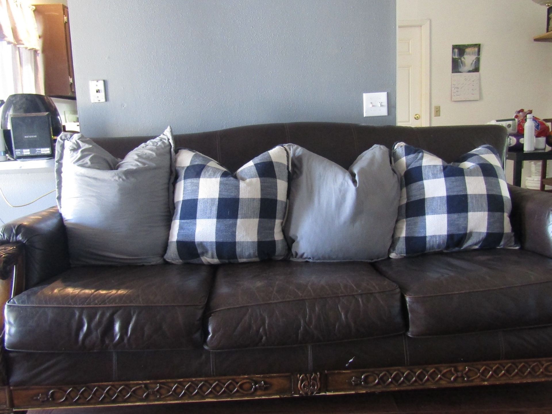 Rustic Leather Couch With Elegant Wooden Frame