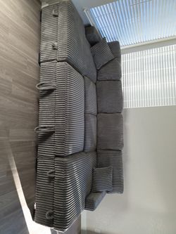 Grey sectional with storage and pullout bed SALE