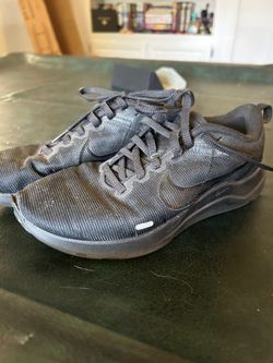 All black Nike shoes
