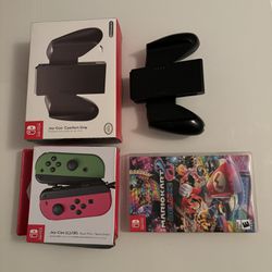 Nintendo switch controller pack with two comfort controller grips. Comes with Mario cart deluxe.