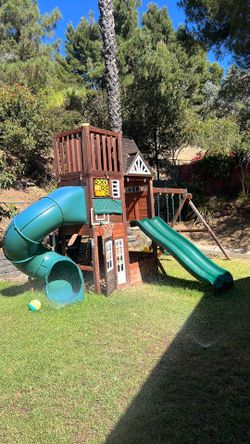 KidKraft Cedar Summit Wooden Playset – Tube Slide, Double Slide & Swings