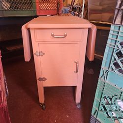 Vintage enamel top rolling cabinet