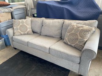 Grey sofa bed.. turns into a full size bed