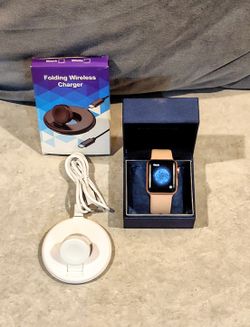 APPLE SMART WATCH SERIES 2 ROSE GOLD ALUMINUM CASE & SILICONE BAND WITH CERAMIC BACK. INCLUDES FOLDING WIRELESS CHARGER & CORD. 