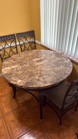 Granite round table with four chairs