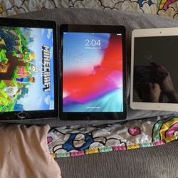 3 iPads All Work But 2 Are Cracked.