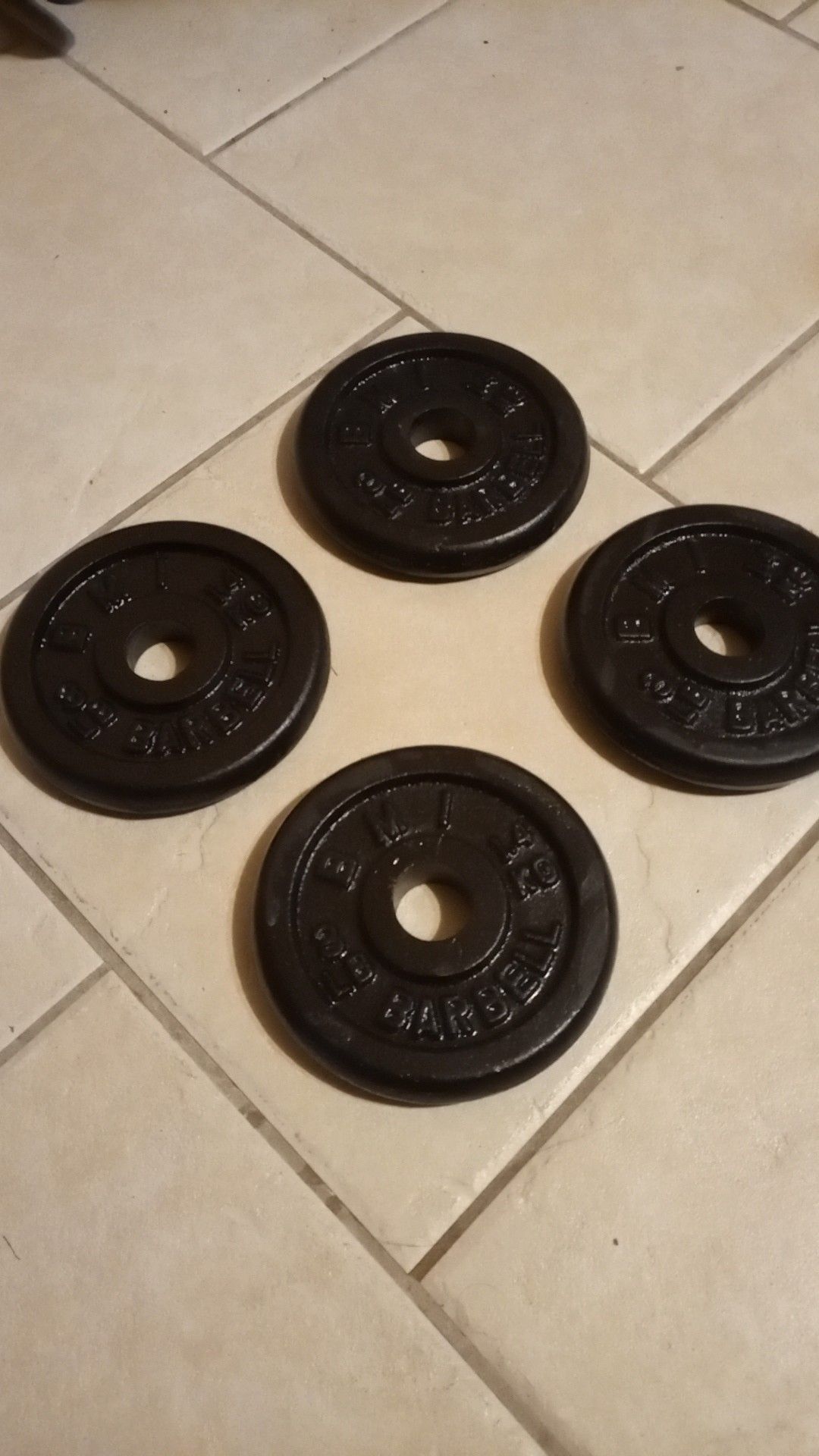 4 black Steel BMI 3 lbs / pound standard barbell weight plates 1 inch hole.