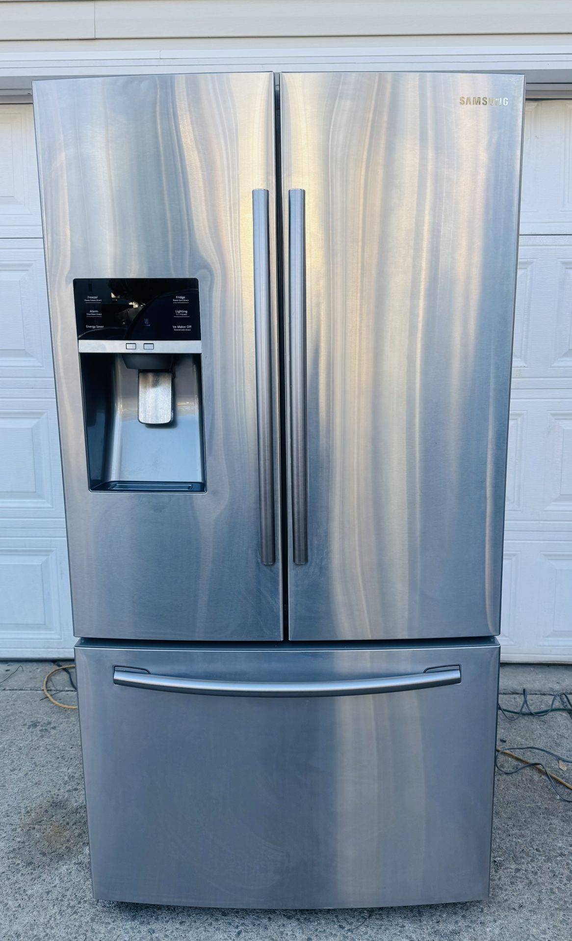 Samsung 28 cu. ft. swing door refrigerator with stainless steel cabinet.