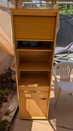 tall shelf with sliding door