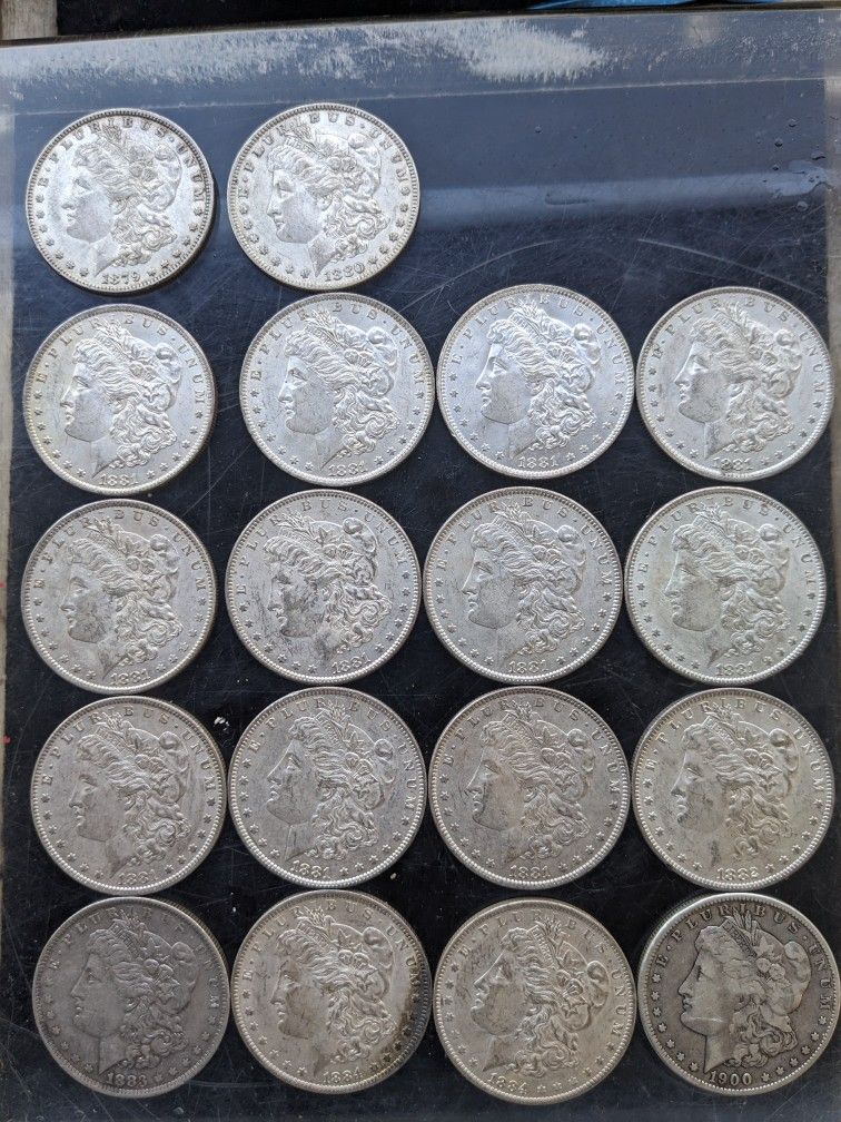 18 Morgan Silver Dollars