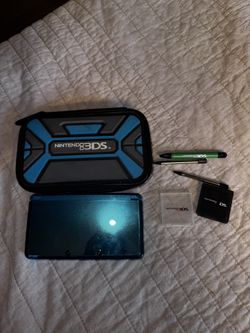 Aqua Blue Nintendo 3DS With Case, Charger, Three Stylusses, And A Couple Game Cases