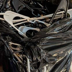 Like New Large Black Bag Full Of  Clothes Hangers. 